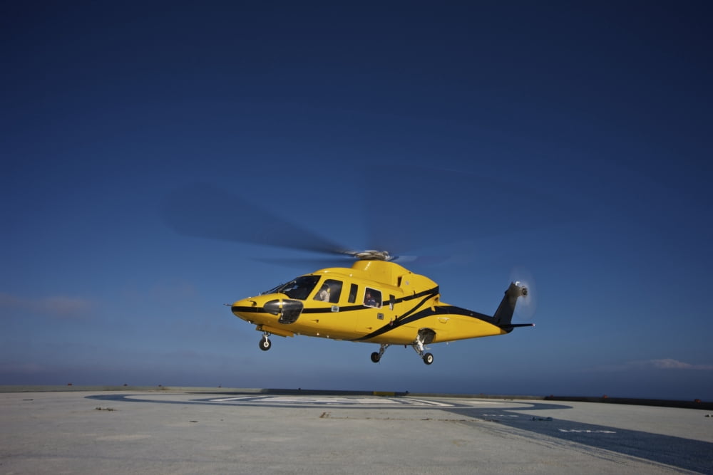 A Sikorsky S-76 utility helicopter taking off from an oil rig Canvas Art - Terry MooreStocktrek Images (18 x 12)