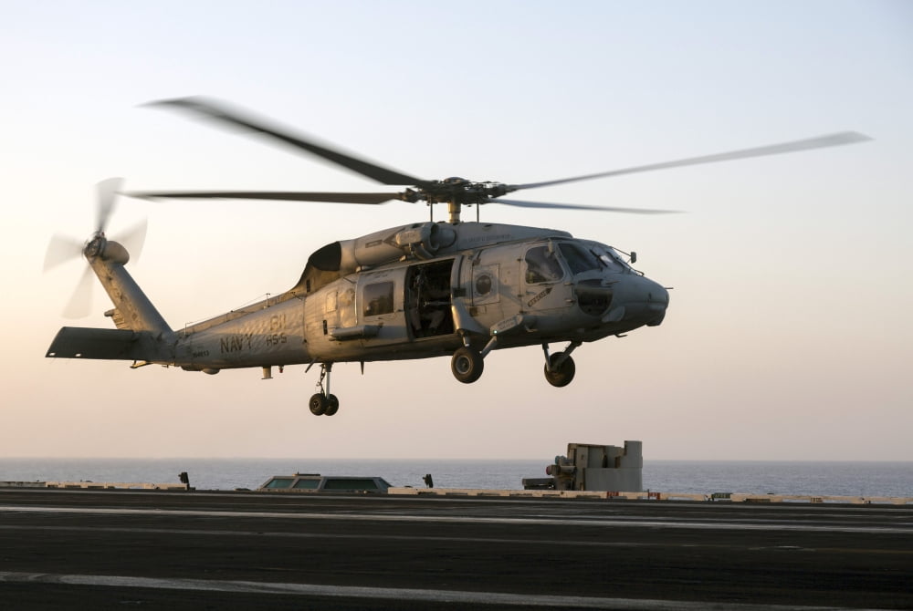 A Sikorsky SH-60F Seahawk lands on the flight deck of USS Dwight D Eisenhower Canvas Art - Gert KromhoutStocktrek Images (35 x 24)