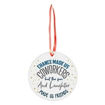 A Single Round Christmas Ornament With Printed Design And Ribbon For Tree Decoration And Festive Home Accents