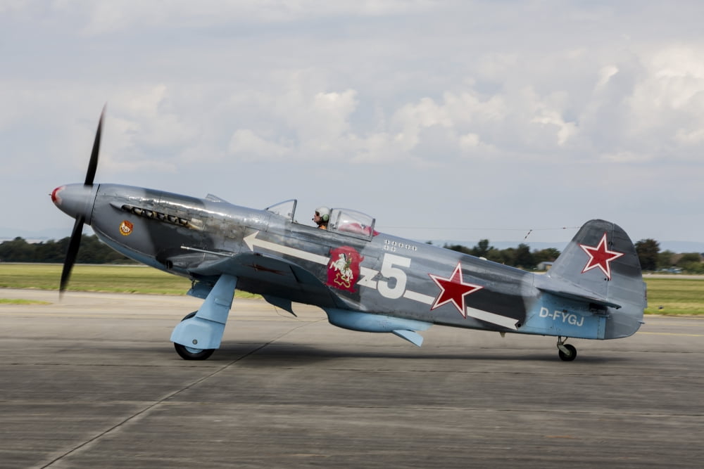 A Soviet Air Force Yak-3 replica on the runway Canvas Art - Timm ZiegenthalerStocktrek Images (34 x 23)