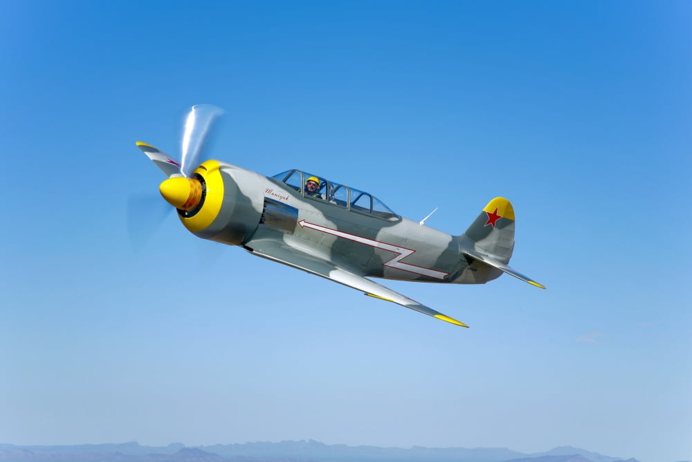 A Soviet Yakovlev Yak-11 aircraft in flight Canvas Art - Scott GermainStocktrek Images (18 x 12)