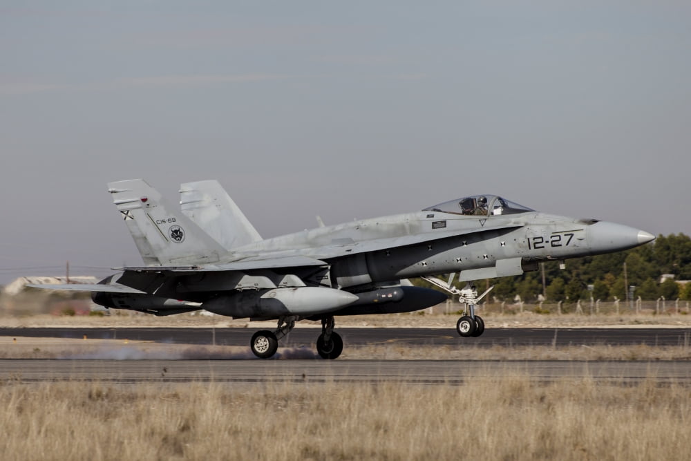 A Spanish Air Force F-18M Hornet lands on runway Canvas Art - Timm ZiegenthalerStocktrek Images (34 x 23)