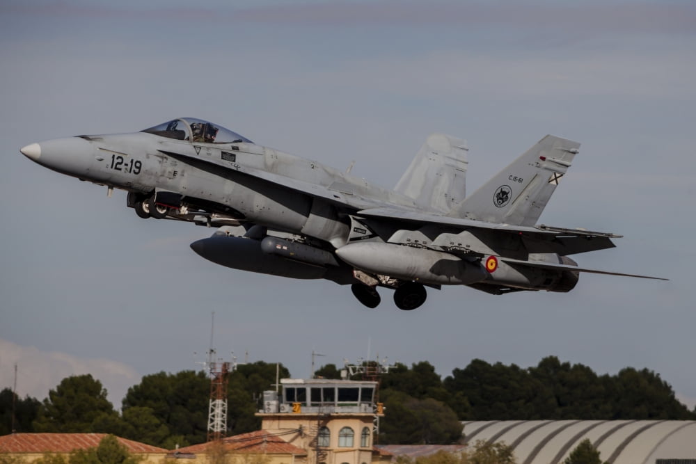 A Spanish Air Force F-18M Hornet taking off from Albacete Air Base Spain Canvas Art - Timm ZiegenthalerStocktrek Images (34 x 23)