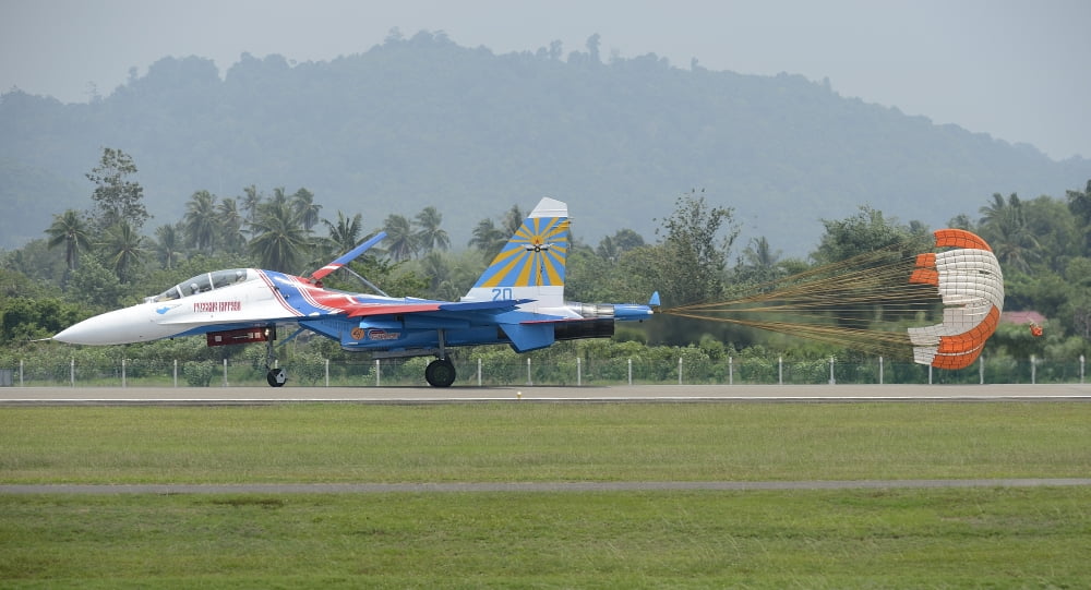 A Sukhoi Su-27 Flanker of the Russian Knights with parachute deployed Canvas Art - Remo GuidiStocktrek Images (38 x 21)