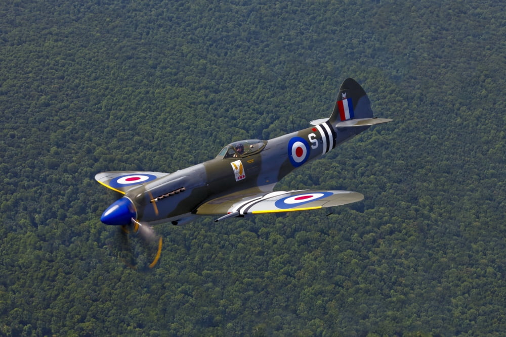 A Supermarine Spitfire Mk-18 in flight Canvas Art - Scott GermainStocktrek Images (35 x 23)