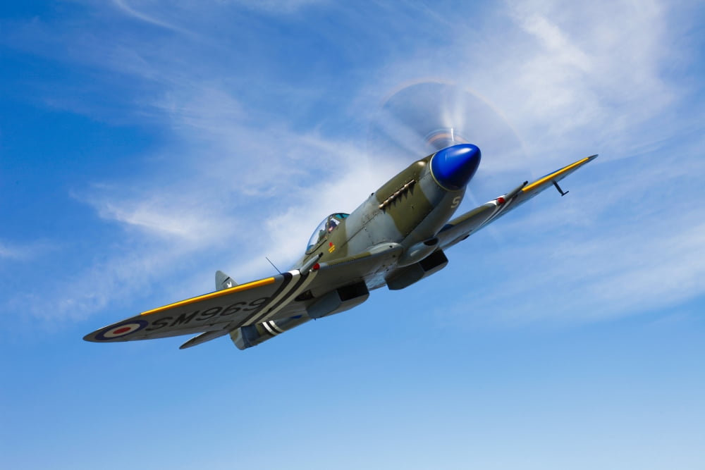 A Supermarine Spitfire Mk-18 in flight Canvas Art - Scott GermainStocktrek Images (35 x 23)
