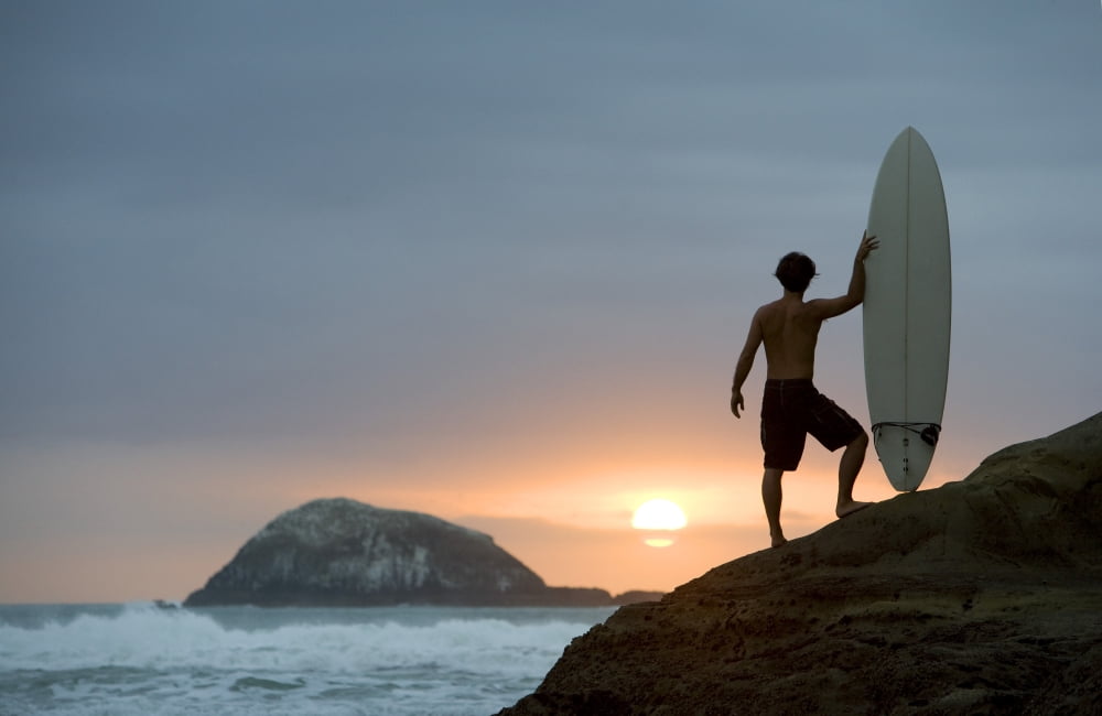A Surfer On Muriwai Beach New Zealand Canvas Art - Deddeda Design Pics (34 x 22)