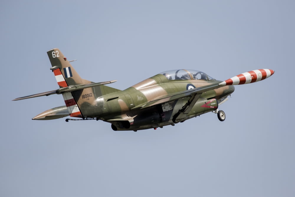 A T-2E Buckeye trainer aircraft of the Hellenic Air Force flying over Kalamata Greece Canvas Art - Timm ZiegenthalerStocktrek Images (17 x 12)