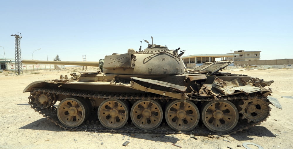 A T-55 tank destroyed by NATO forces in the desert north of Ajadabiya Libya Canvas Art - Andrew ChittockStocktrek Images (40 x 20)