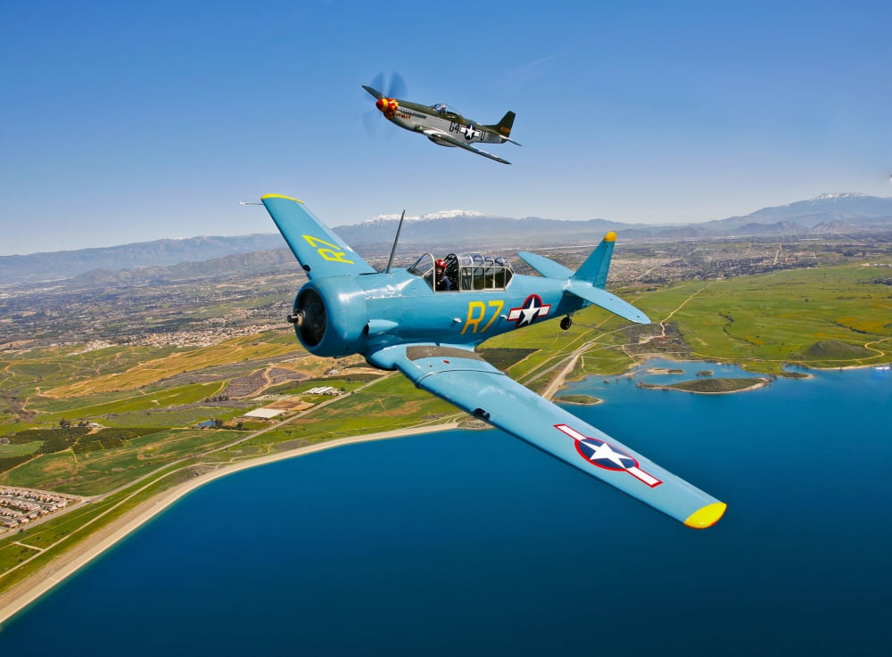 A T-6 Texan and P-51D Mustang in flight over Chino California Canvas Art - Scott GermainStocktrek Images (17 x 12)