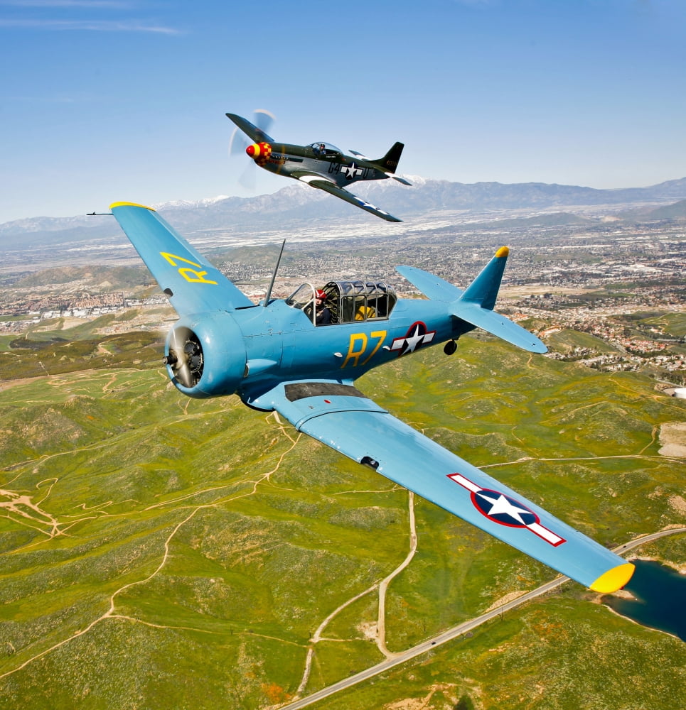 A T-6 Texan and P-51D Mustang in flight over Chino California Canvas Art - Scott GermainStocktrek Images (28 x 29)