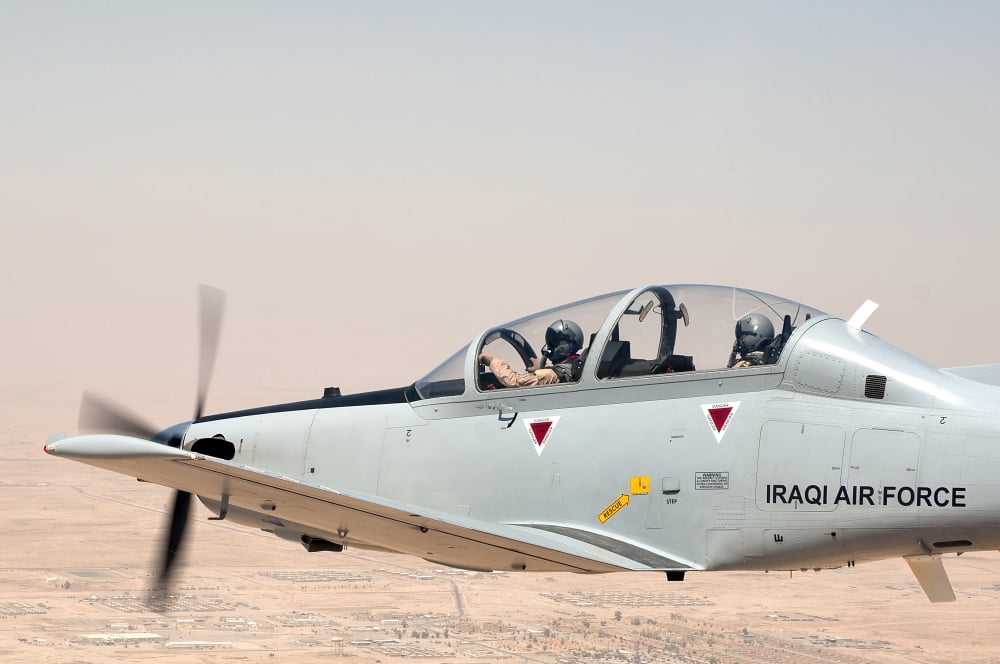 A T-6 Texan flying over Camp Speicher Tikrit Iraq Canvas Art - Stocktrek Images (35 x 24)