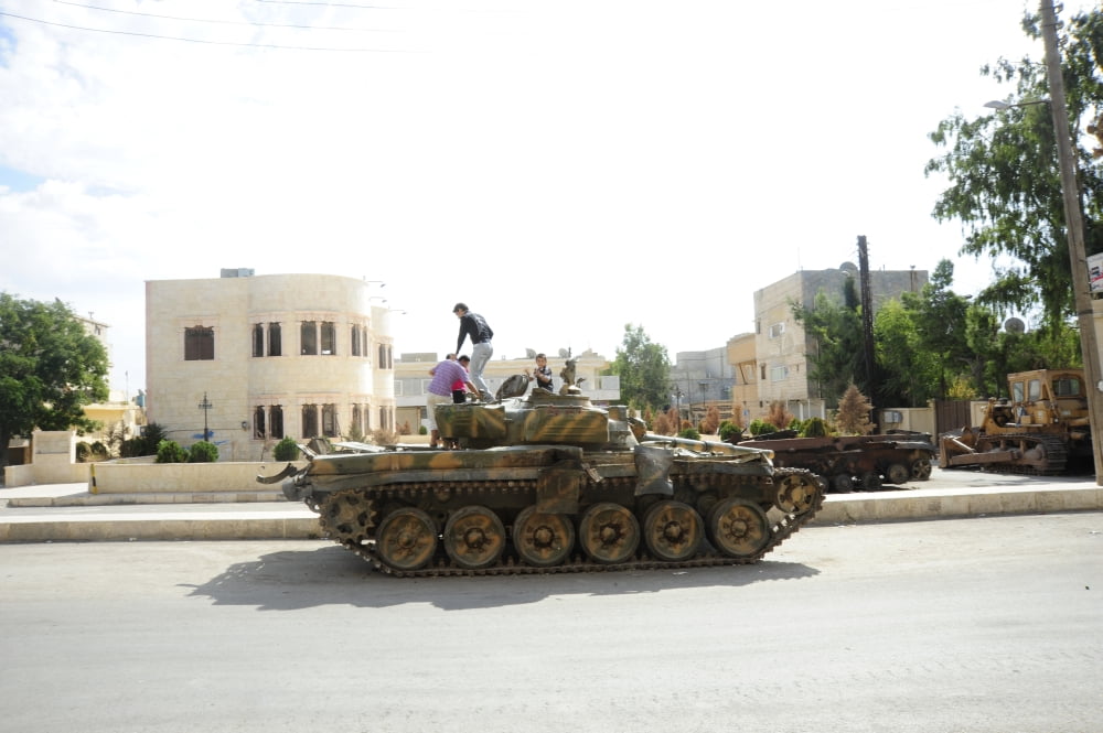 A T-72 main battle tank on the streets of Azaz Syria Canvas Art - Andrew ChittockStocktrek Images (35 x 23)