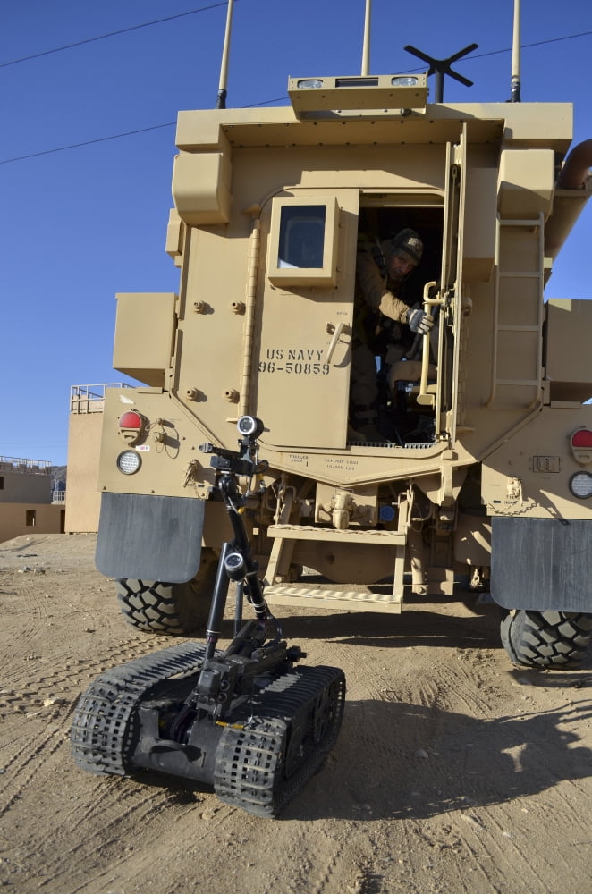 A Talon Mark 2 bomb disposal robot is deployed from a rapid response vehicle Canvas Art - Stocktrek Images (23 x 35)
