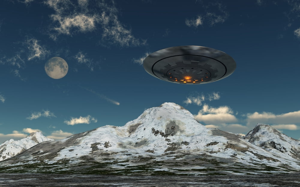 A UFO flying over a mountain range Canvas Art - Mark StevensonStocktrek Images (18 x 12)