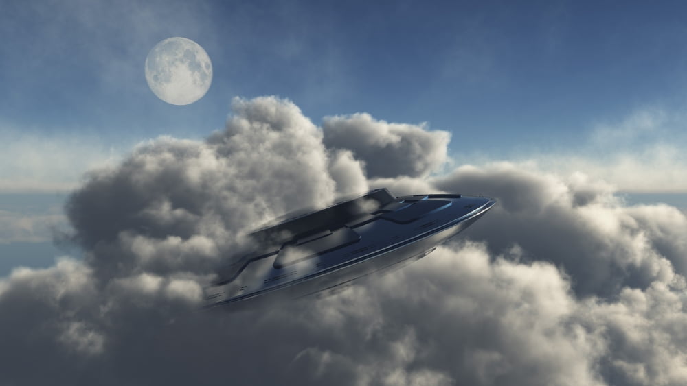 A UFO hiding in a dense cloud formation Canvas Art - Mark StevensonStocktrek Images (19 x 11)