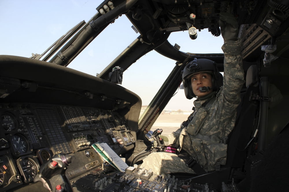 A UH-60 Black Hawk helicopter instructor pilot runs a preflight check Canvas Art - Stocktrek Images (35 x 23)