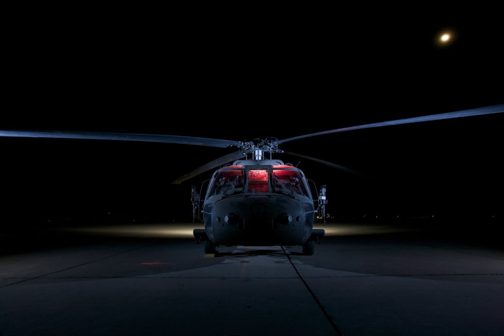 A UH-60 Black Hawk helicopter lit up by multiple external flash units Canvas Art - Terry MooreStocktrek Images (18 x 12)