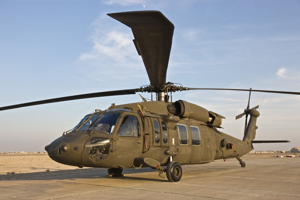 A UH-60 Black Hawk parked at a military base in Tikrit Iraq Canvas Art - Terry MooreStocktrek Images (35 x 23)