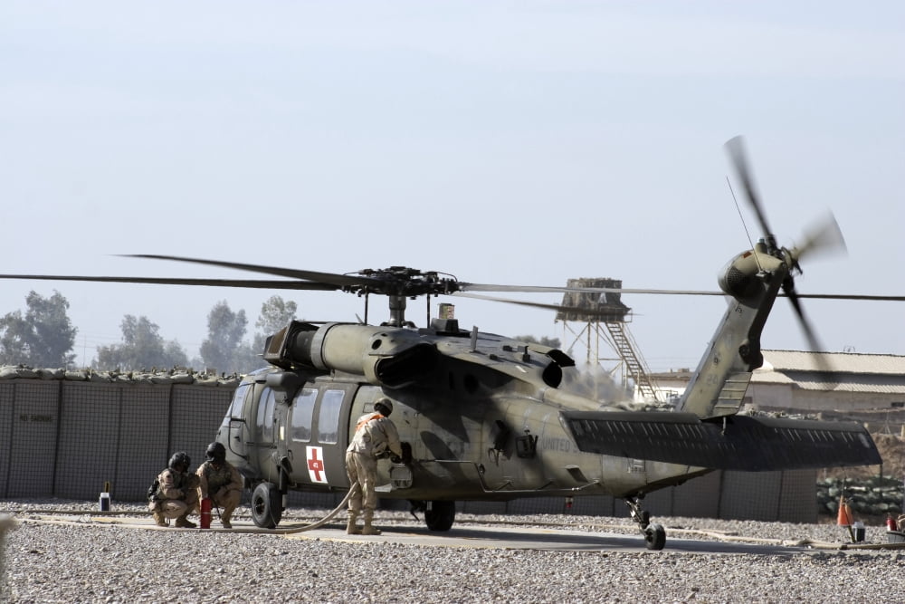 A UH-60 Blackhawk Medivac helicopter refuels at Camp Warhorse after a mission Canvas Art - Terry MooreStocktrek Images (18 x 12)