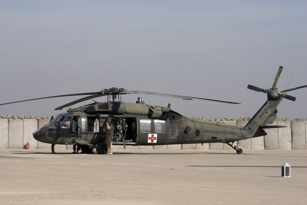 A UH-60 Blackhawk Medivac helicopter refuels at Camp Warhorse after a mission Canvas Art - Terry MooreStocktrek Images (35 x 23)
