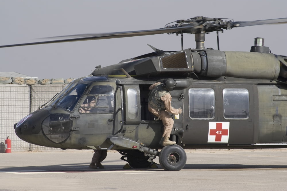 A UH-60 Blackhawk Medivac helicopter refuels at Camp Warhorse after a mission Canvas Art - Terry MooreStocktrek Images (35 x 23)