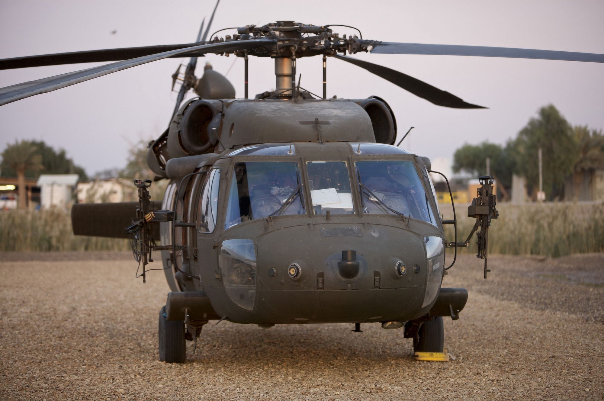 A UH-60L Black Hawk with twin M240G machine guns at the Victory Base complex in Baghdad Iraq Canvas Art - Terry MooreStocktrek Images (18 x 12)