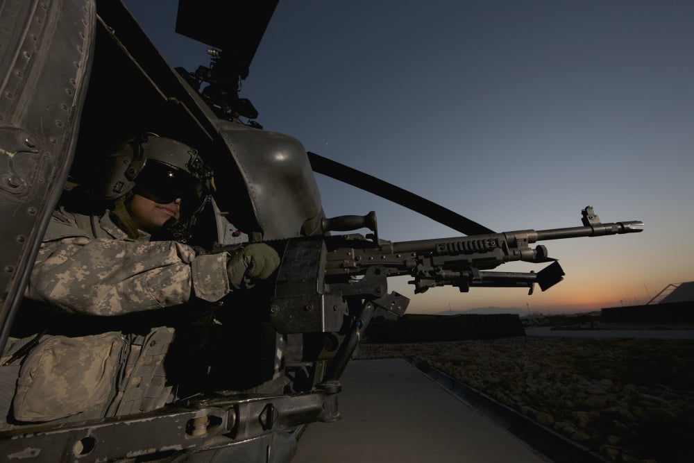 A UH-60L Blackhawk door gunner mans a M-240G machine gun Canvas Art - Terry MooreStocktrek Images (35 x 24)