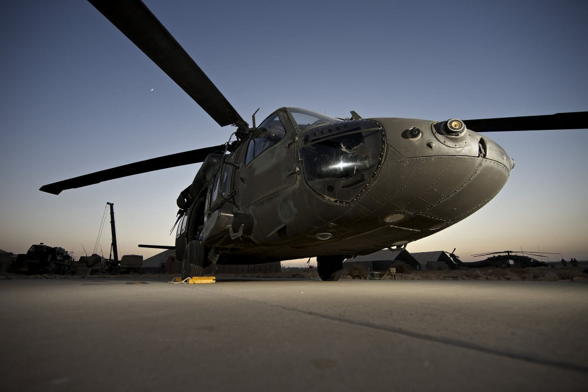 A UH-60L Blackhawk parked on its pad Canvas Art - Terry MooreStocktrek Images (18 x 12)