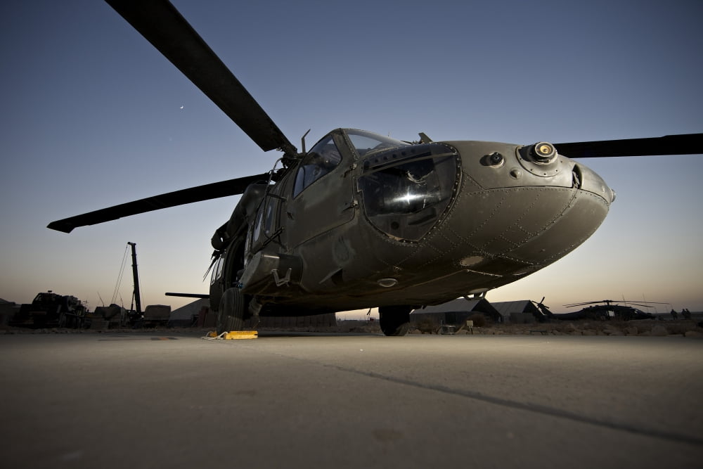 A UH-60L Blackhawk parked on its pad Canvas Art - Terry MooreStocktrek Images (35 x 24)