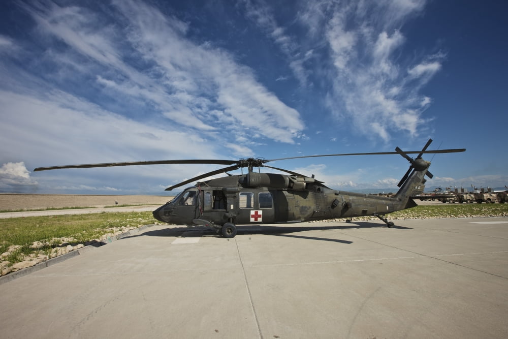 A UH-60L Blackhawk parked on its pad in Kunduz Afghanistan Canvas Art - Terry MooreStocktrek Images (18 x 12)