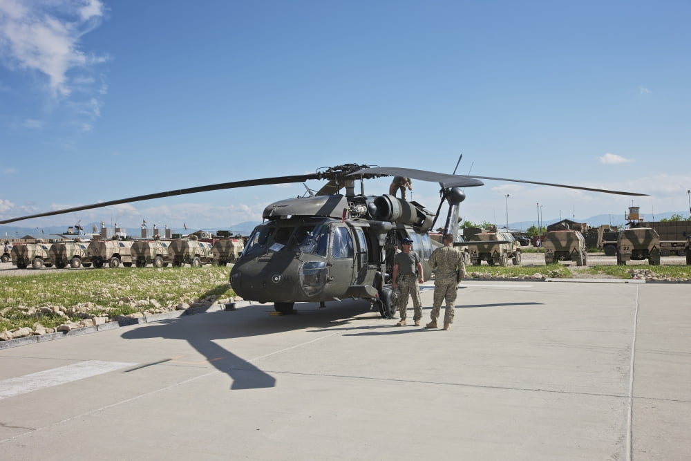 A UH-60L Blackhawk parked on its pad in Kunduz Afghanistan Canvas Art - Terry MooreStocktrek Images (18 x 12)