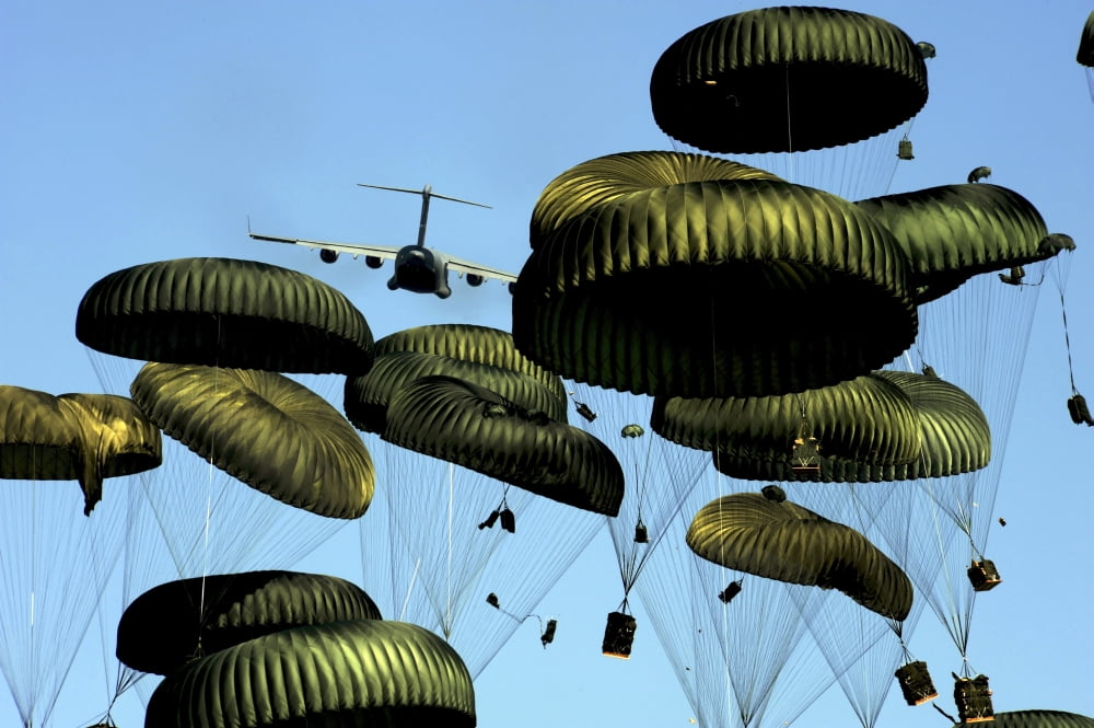 A US Air Force C-17 Globemaster III airdrops pallets to Port-au-Prince Haiti Canvas Art - Stocktrek Images (34 x 23)