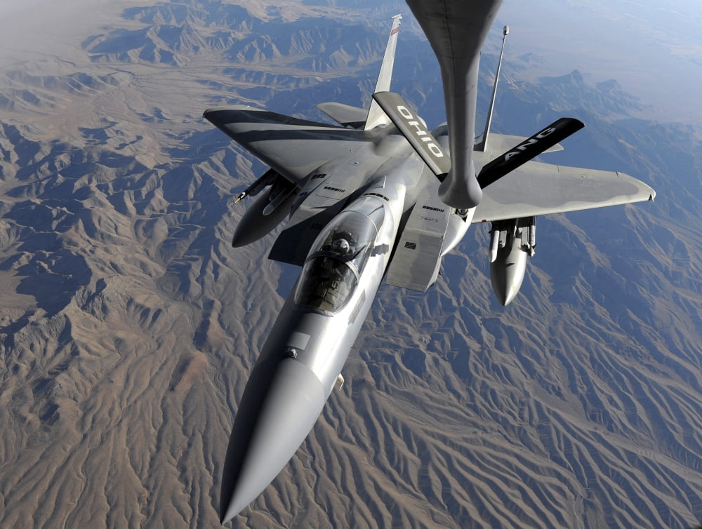 A US Air Force F-15 Eagle flies toward the boom of a KC-135 Stratotanker Canvas Art - Stocktrek Images (33 x 25)