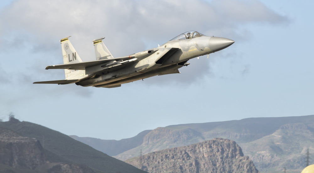 A US Air Force F-15C Eagle in flight over Spain Canvas Art - Giovanni CollaStocktrek Images (19 x 11)