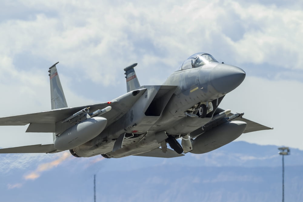 A US Air Force F-15C Eagle taking off from Nellis Air Force Base Canvas Art - Rob EdgcumbeStocktrek Images (34 x 23)