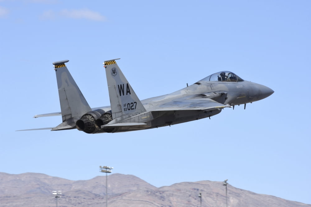 A US Air Force F-15C Eagle taking off from Nellis Air Force Base Nevada Canvas Art - Riccardo NiccoliStocktrek Images (17 x 12)