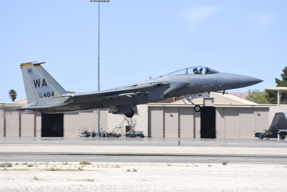 A US Air Force F-15C Eagle taking off from Nellis Air Force Base Nevada Canvas Art - Riccardo NiccoliStocktrek Images (34 x 23)