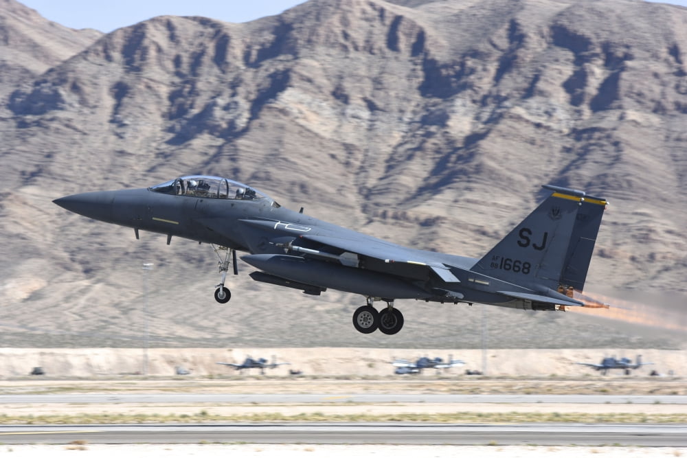 A US Air Force F-15E Strike Eagle taking off from Nellis Air Force Base Nevada Canvas Art - Riccardo NiccoliStocktrek Images (17 x 12)