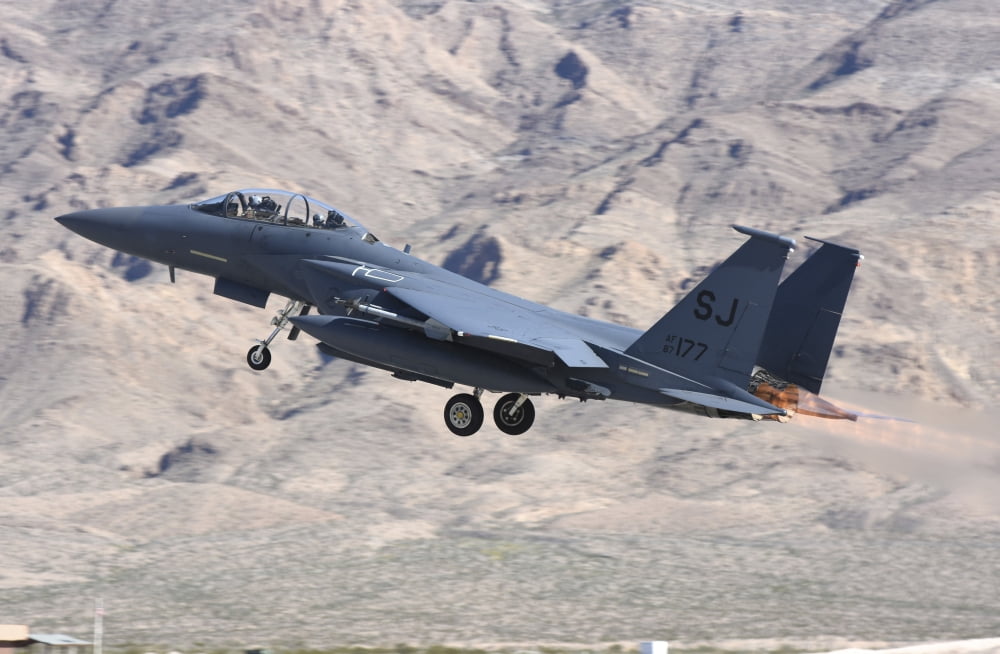 A US Air Force F-15E Strike Eagle taking off from Nellis Air Force Base Nevada Canvas Art - Riccardo NiccoliStocktrek Images (17 x 12)