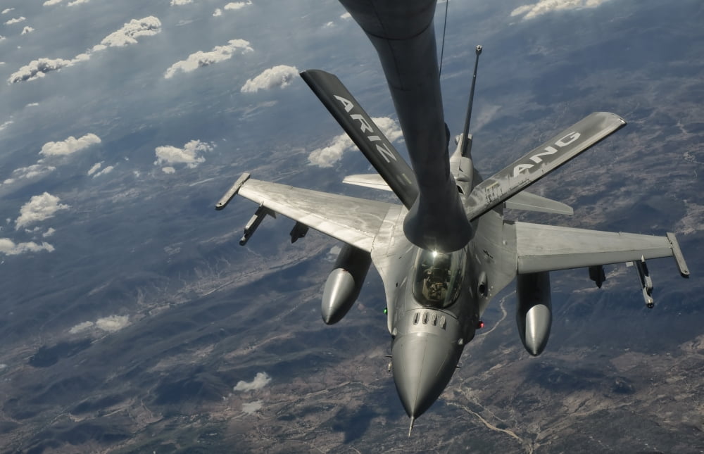 A US Air Force F-16C Block 50 Fighting Falcon receives in-flight refueling Canvas Art - Giovanni CollaStocktrek Images (18 x 12)