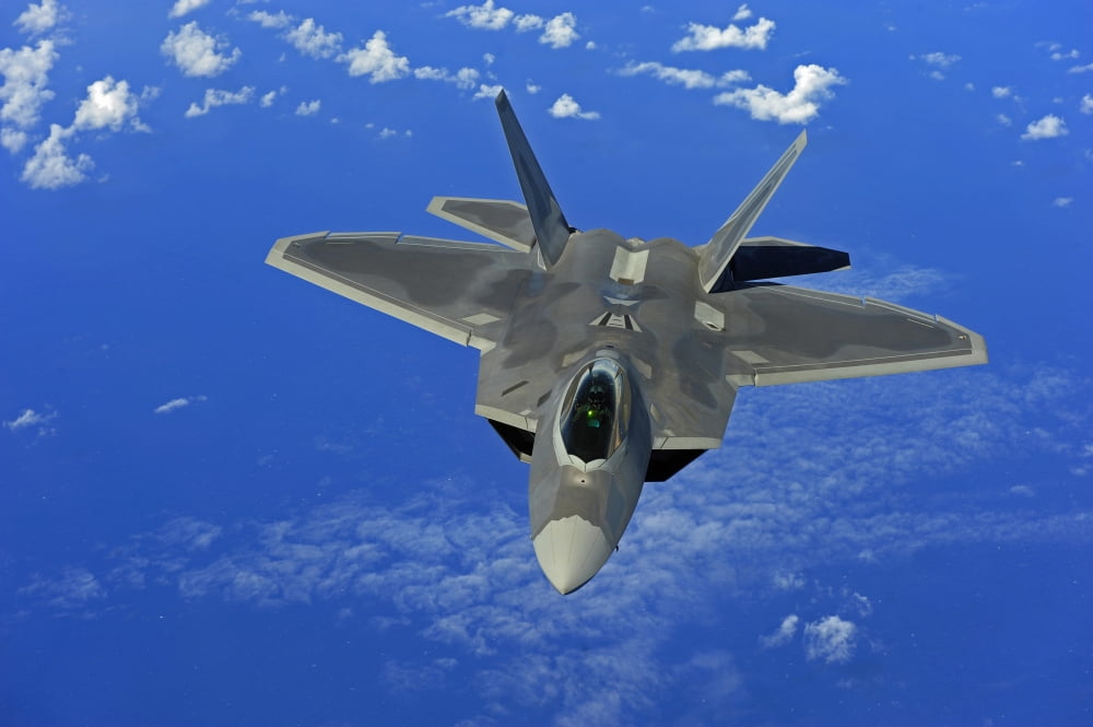 A US Air Force F-22 Raptor in flight near Guam Canvas Art - Stocktrek Images (34 x 23)