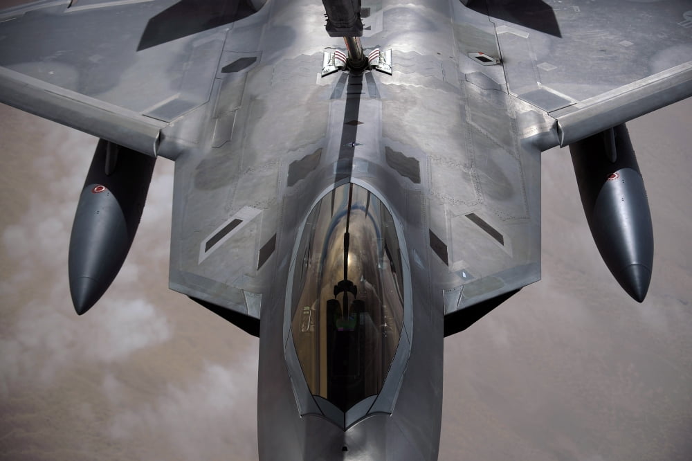 A US Air Force F-22 Raptor is refueled by a KC-10A Extender Canvas Art - Stocktrek Images (34 x 23)