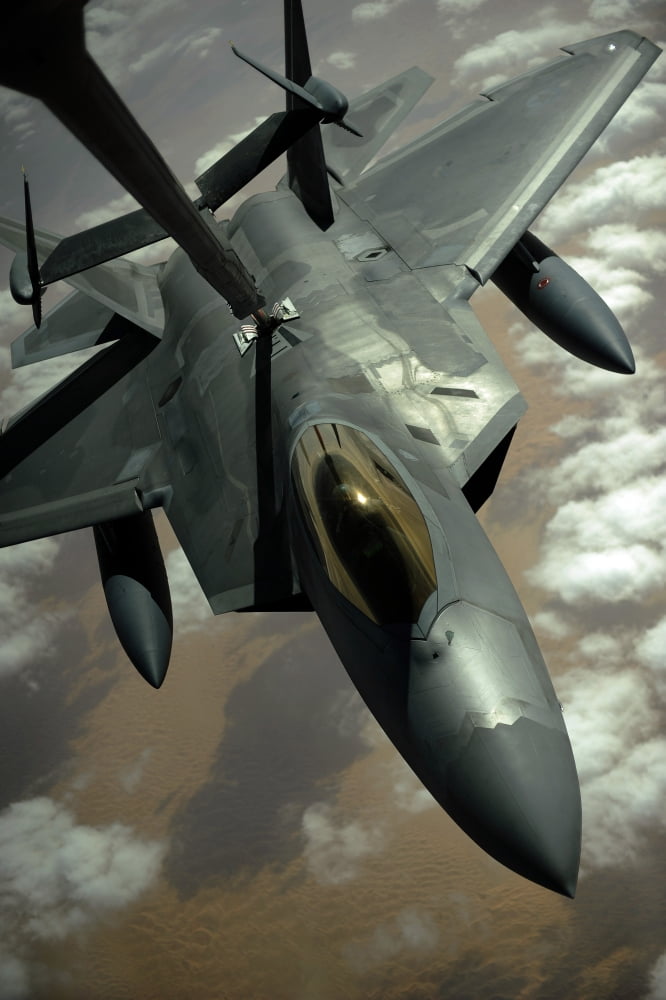 A US Air Force F-22 Raptor is refueled by a KC-10A Extender aircraft over southwest Asia Canvas Art - Stocktrek Images (23 x 35)