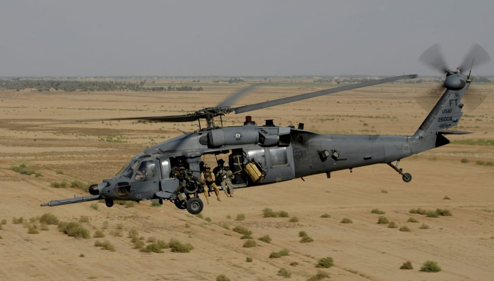 A US Air Force HH-60 Pavehawk flies over the Iraqi landscape Canvas Art - Stocktrek Images (37 x 22)