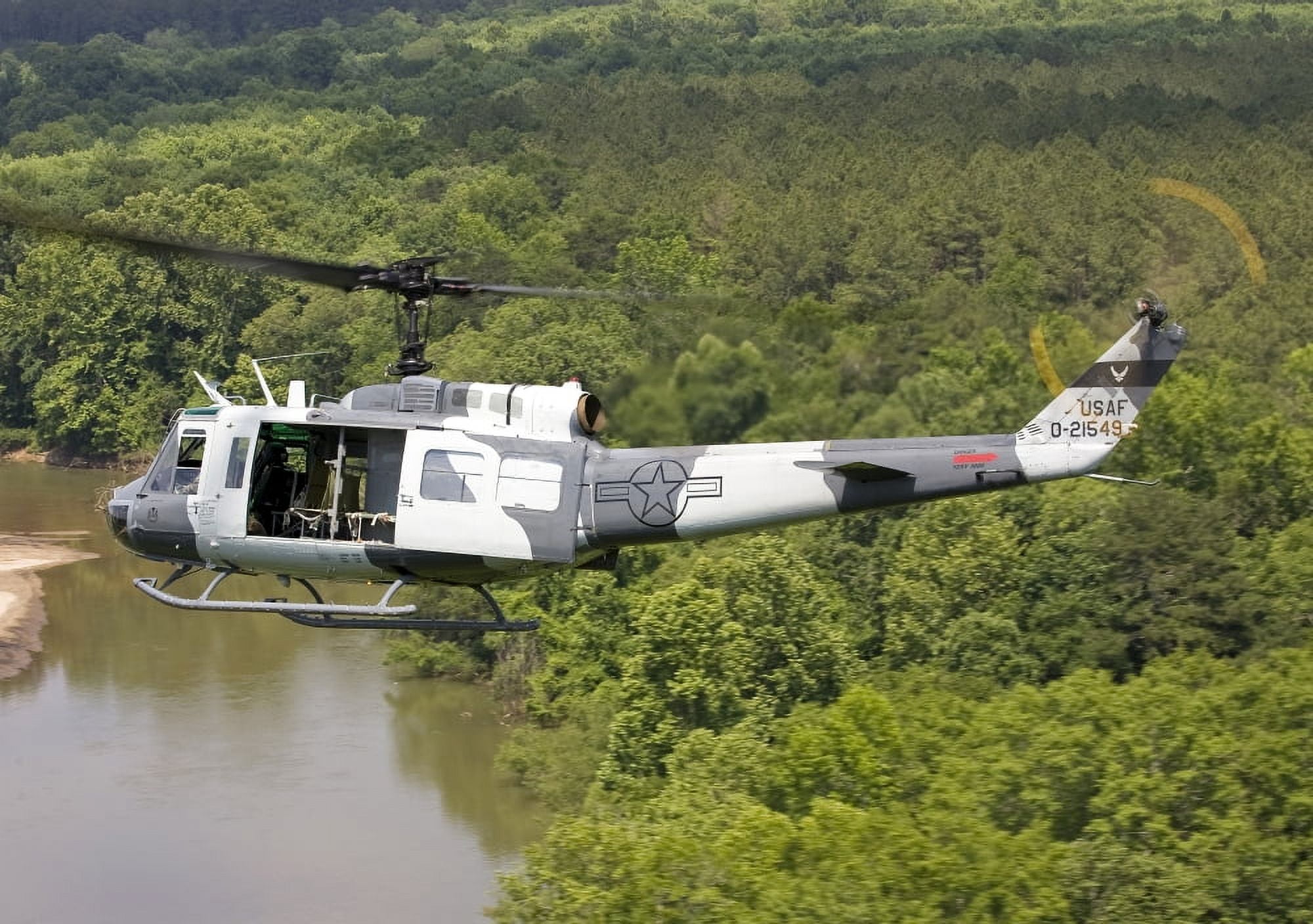 A US Air Force UH-1H Huey in an experiment paint scheme Canvas Art - Erik RoelofsStocktrek Images (34 x 24)