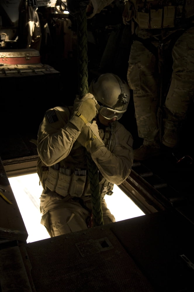 A US Air Force pararescueman begins his descent from the belly of a CH-53E Super Stallion Canvas Art - Stocktrek Images (23 x 35)
