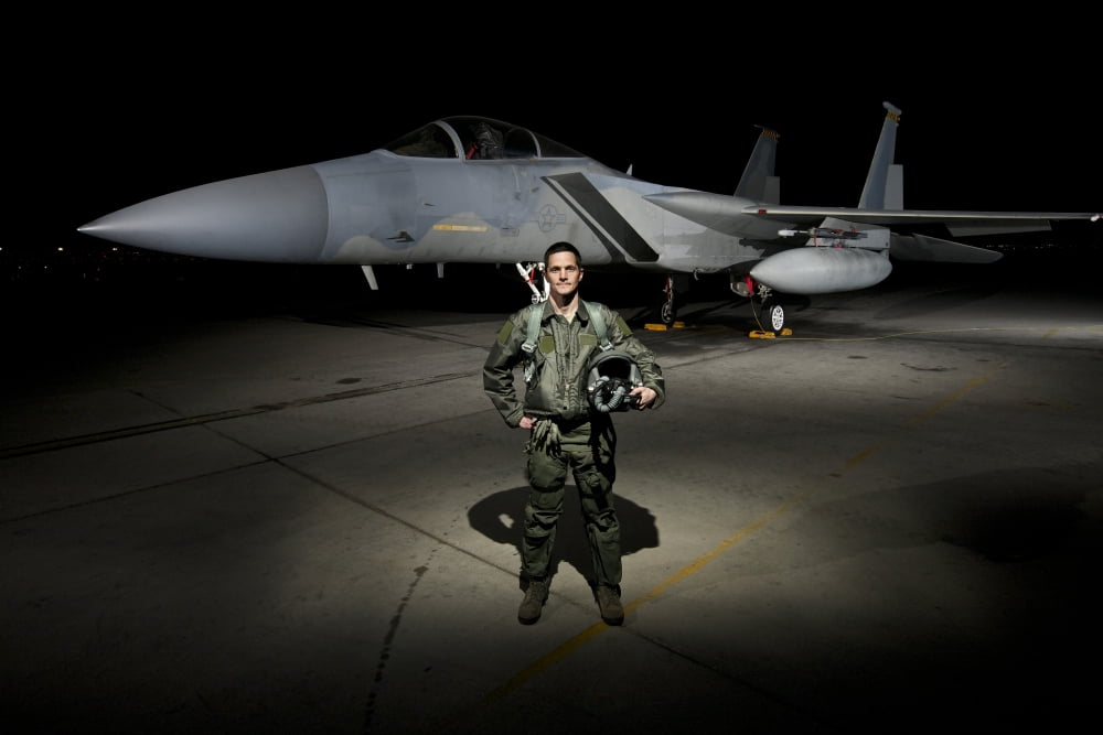 A US Air Force pilot stands in front of a F-15C Eagle Canvas Art - Terry MooreStocktrek Images (35 x 23)