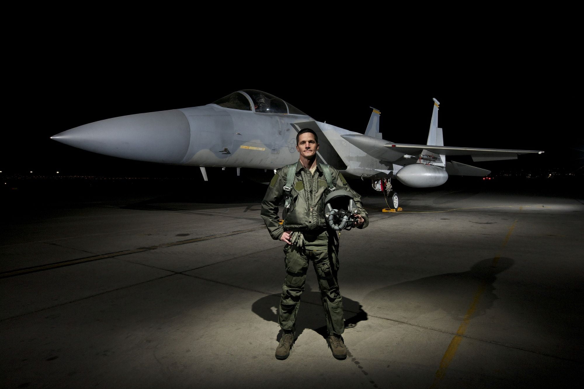 A US Air Force pilot stands in front of a F-15C Eagle Canvas Art - Terry MooreStocktrek Images (35 x 23)