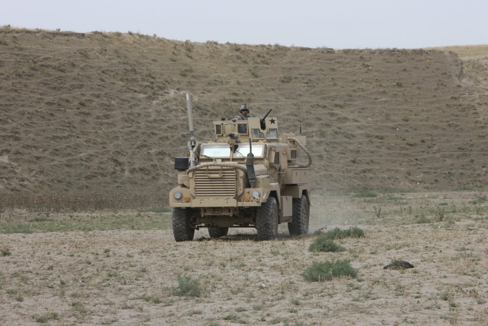 A US Army Cougar patrols a wadi in Kunduz Afghanistan Canvas Art - Terry MooreStocktrek Images (35 x 24)